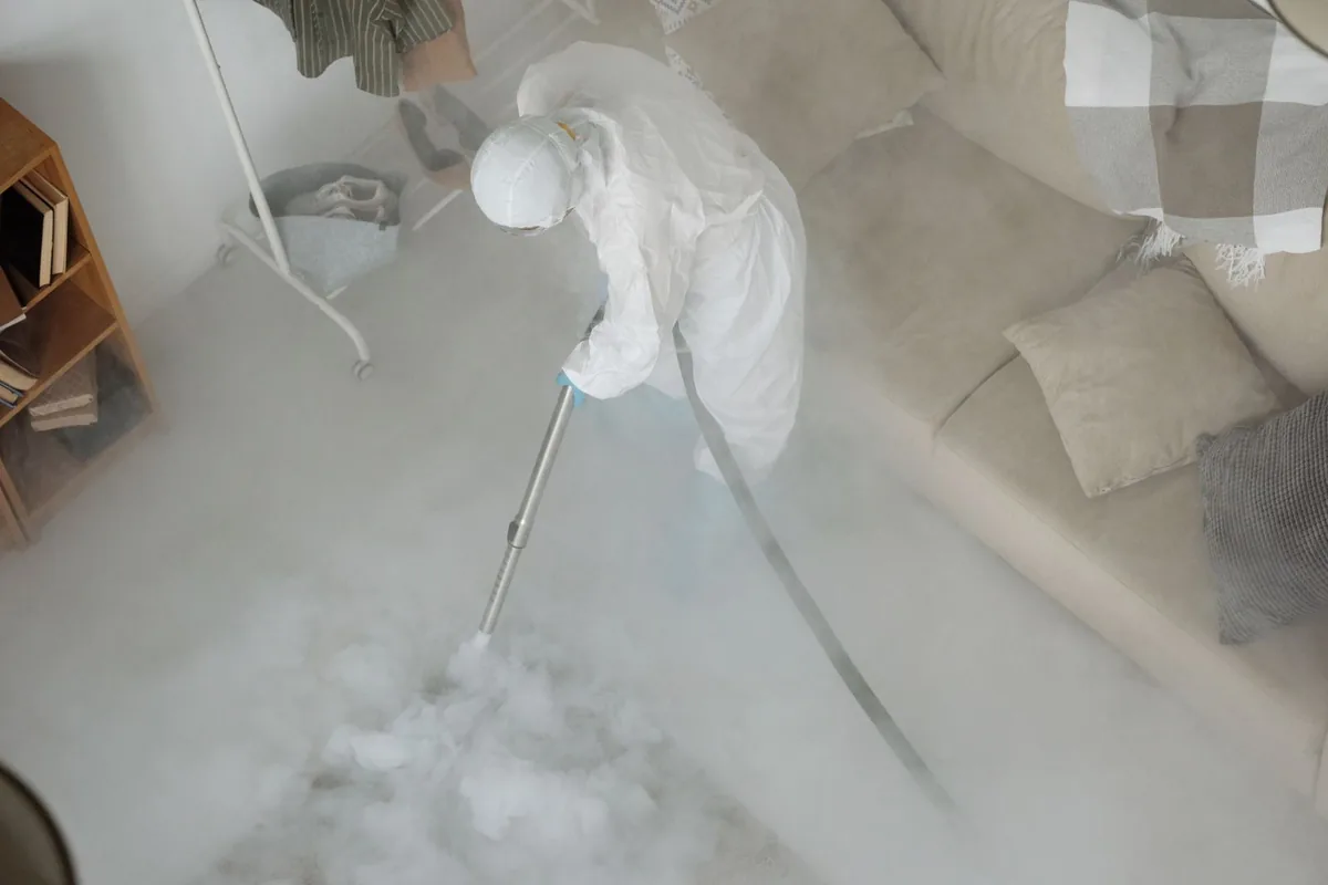 Biohazard cleanup technician in protective equipment, Bellevue, KY